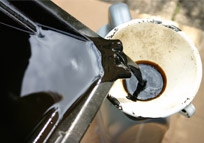 used oil being poured into recepticle